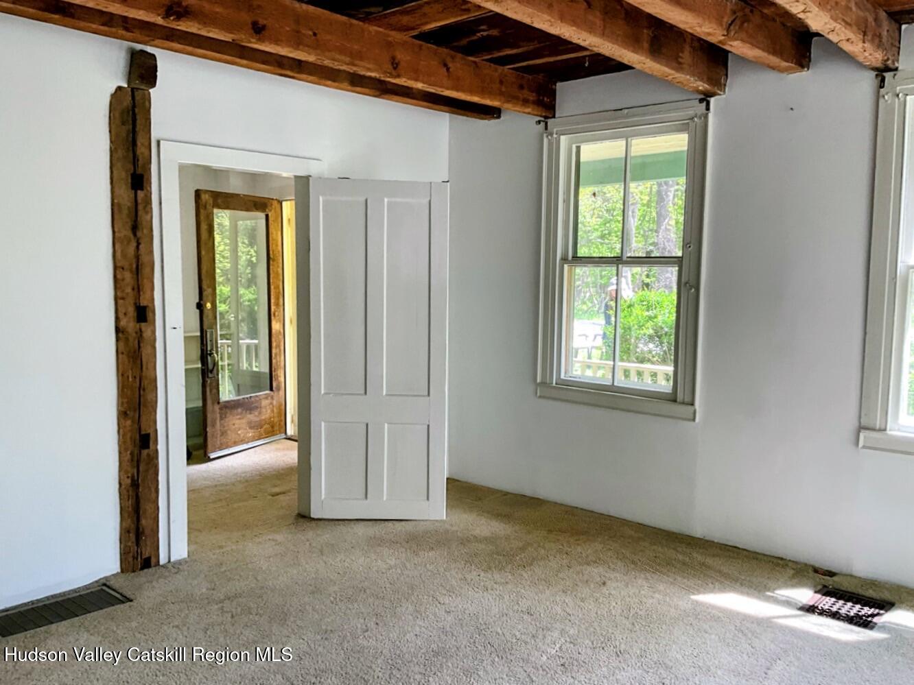 707 Springtown Road Tillson, NY 12486 - Photo 8 of 46 a view of an empty room with a window