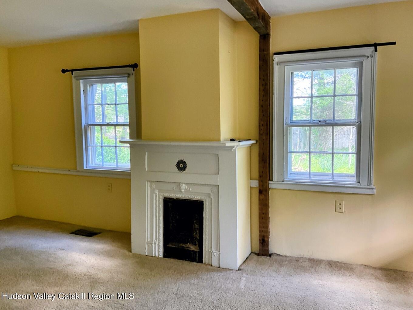 707 Springtown Road Tillson, NY 12486 - Photo 9 of 46 a view of a livingroom with a fireplace and window
