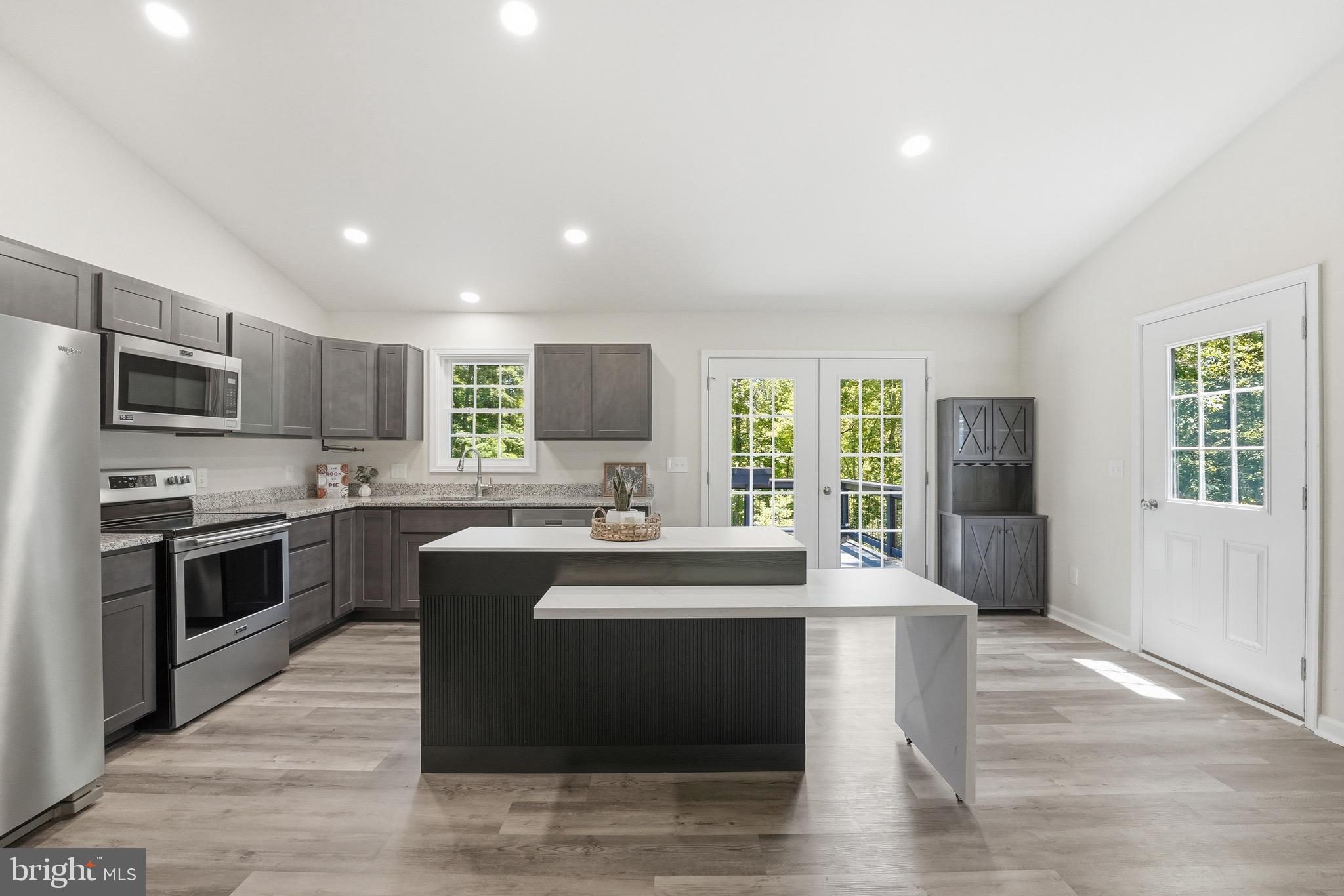 898 Seville Road Madison, VA 22727 - Photo 4 of 40 Bright, open kitchen, doors to deck & side stairs