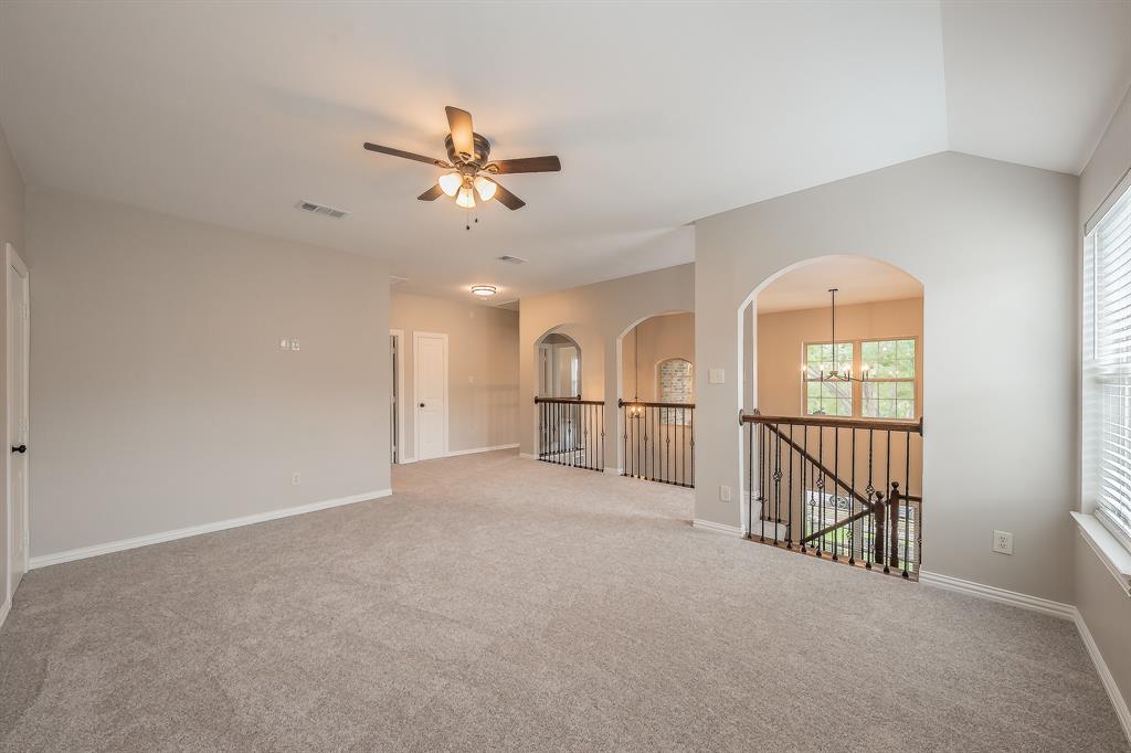 412 Hideaway Road McKinney, TX 75072 - Photo 31 of 40 a view of a livingroom with a ceiling fan and window