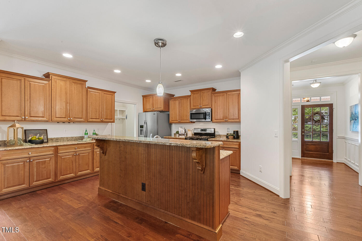 1313 Barnford Mill Road Wake Forest, NC 27587 - Photo 11 of 49 a kitchen with stainless steel appliances granite countertop a refrigerator a sink dishwasher a stove and white countertops with wooden floor