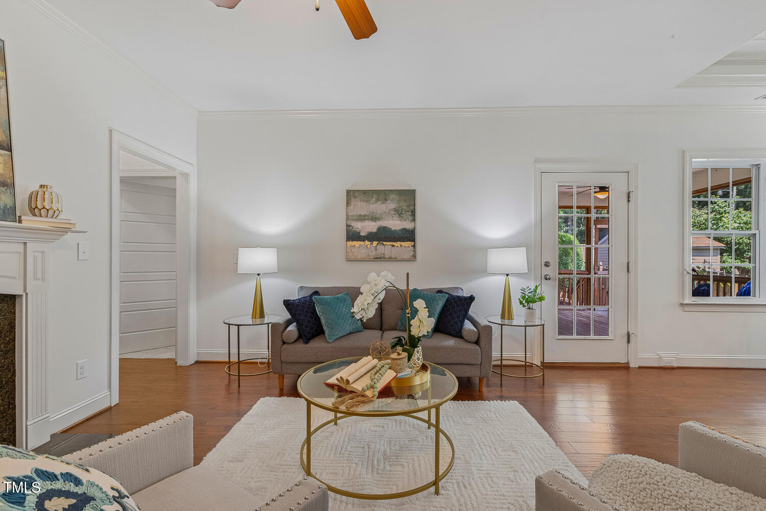 1313 Barnford Mill Road Wake Forest, NC 27587 - Photo 17 of 49 a living room with furniture and a wooden floor