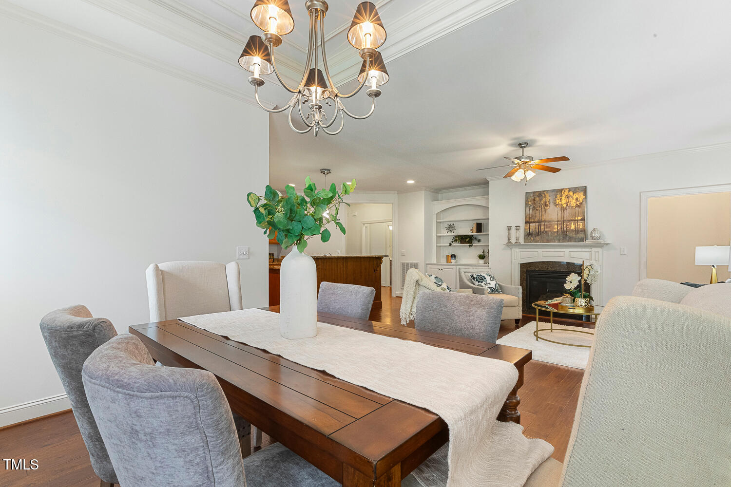 1313 Barnford Mill Road Wake Forest, NC 27587 - Photo 24 of 49 a view of a dining room with furniture wooden floor and chandelier