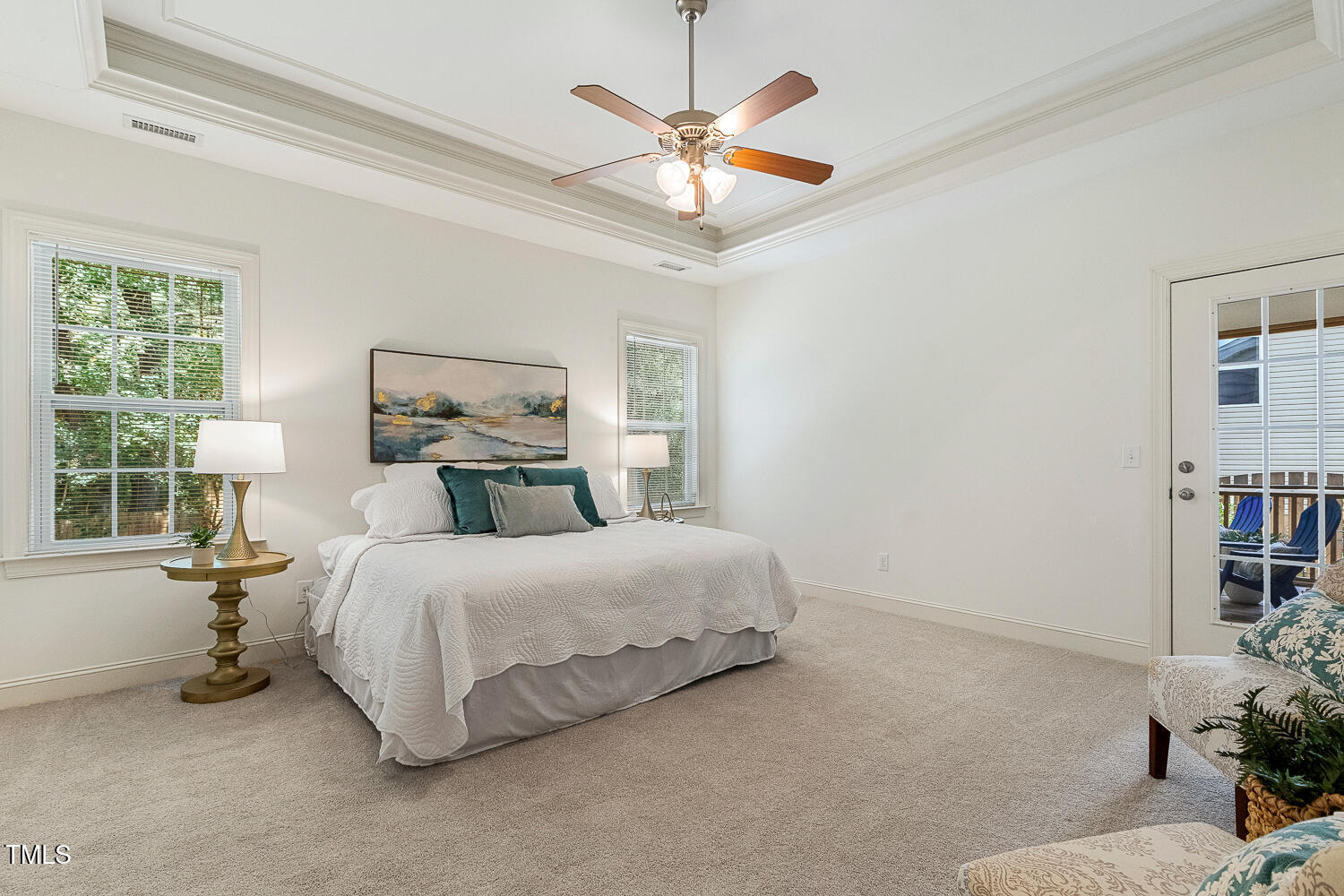 1313 Barnford Mill Road Wake Forest, NC 27587 - Photo 25 of 49 a bedroom with a bed a window and a chandelier