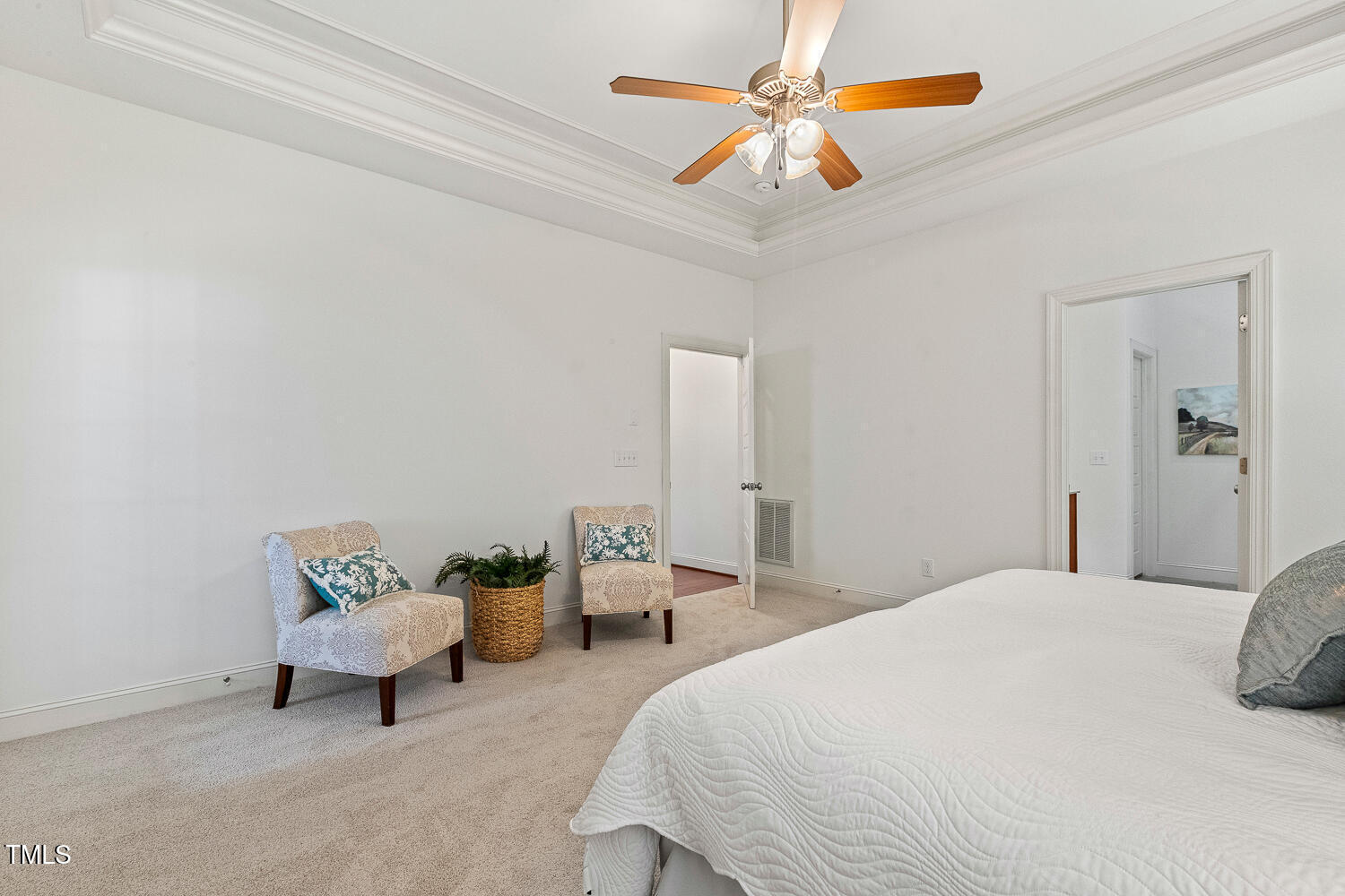 1313 Barnford Mill Road Wake Forest, NC 27587 - Photo 28 of 49 a bedroom with a bed and a chandelier