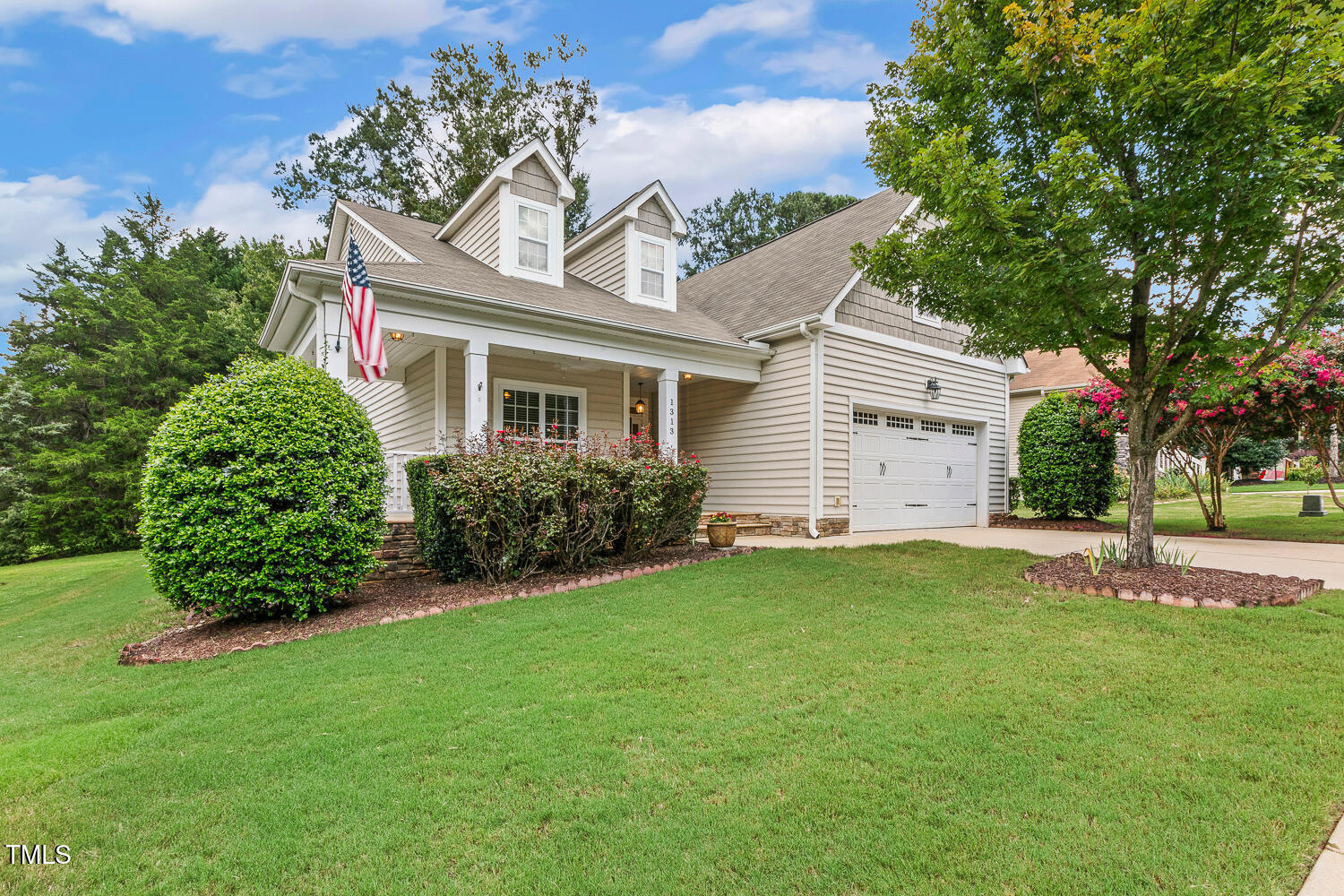 1313 Barnford Mill Road Wake Forest, NC 27587 - Photo 4 of 49 a front view of a house with a garden