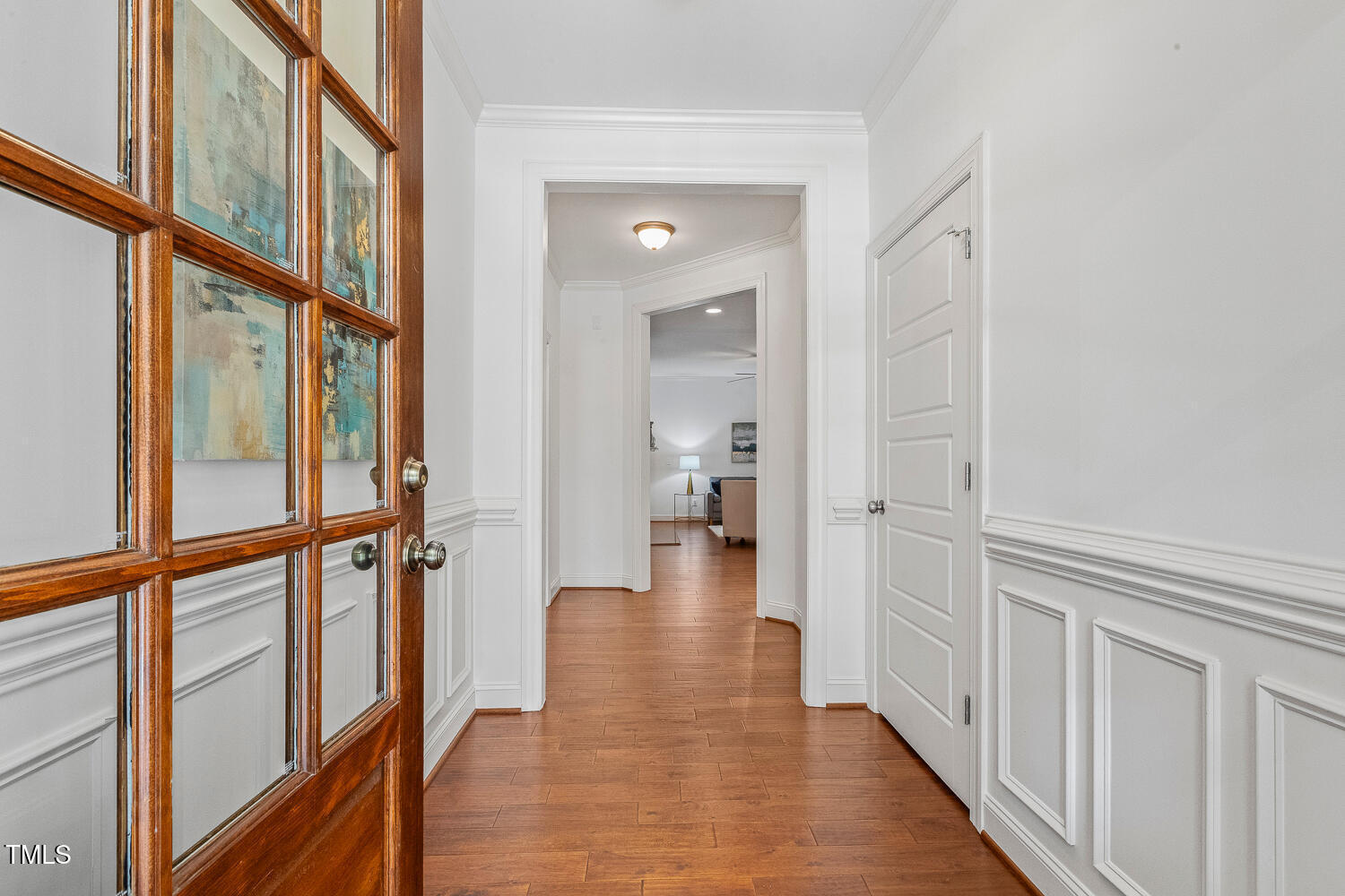 1313 Barnford Mill Road Wake Forest, NC 27587 - Photo 7 of 49 a view of a hallway with wooden floor and staircase