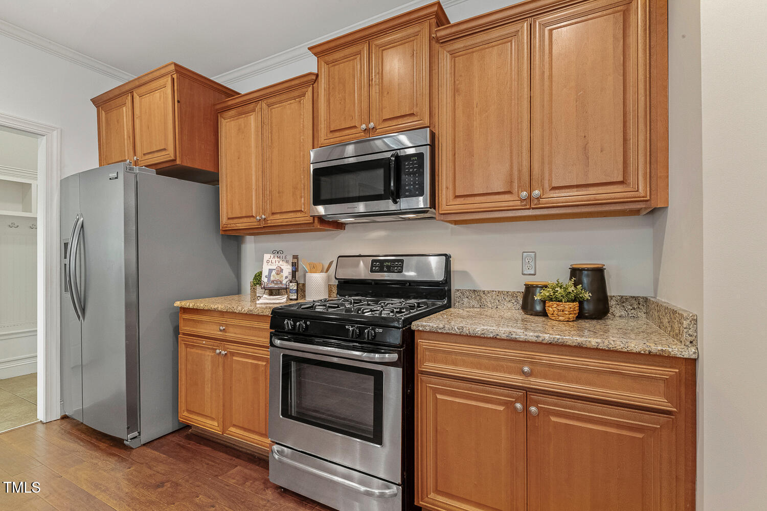 1313 Barnford Mill Road Wake Forest, NC 27587 - Photo 10 of 49 a kitchen with stainless steel appliances granite countertop a refrigerator stove and sink