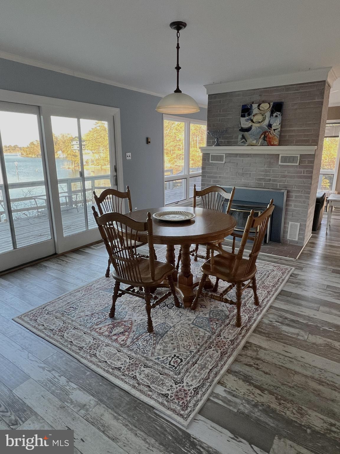 152 Swann Court Reedville, VA 22539 - Photo 12 of 33 a view of a dining room with furniture window and wooden floor