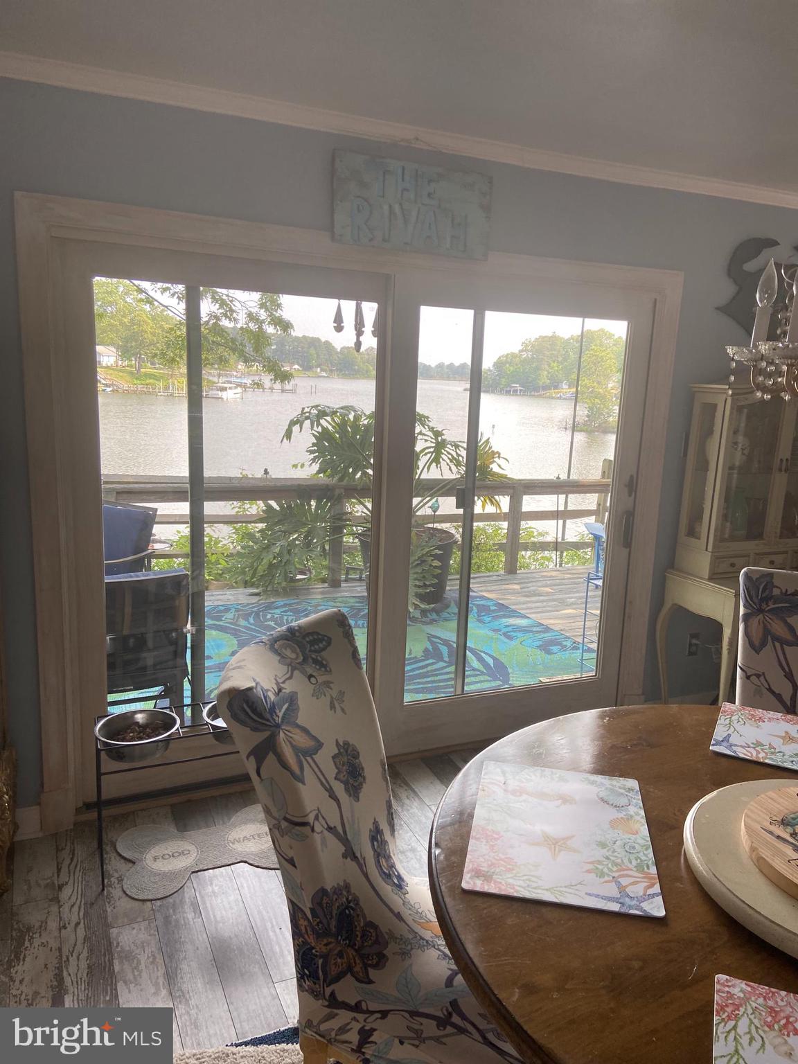 152 Swann Court Reedville, VA 22539 - Photo 13 of 33 a living room with furniture and a floor to ceiling window