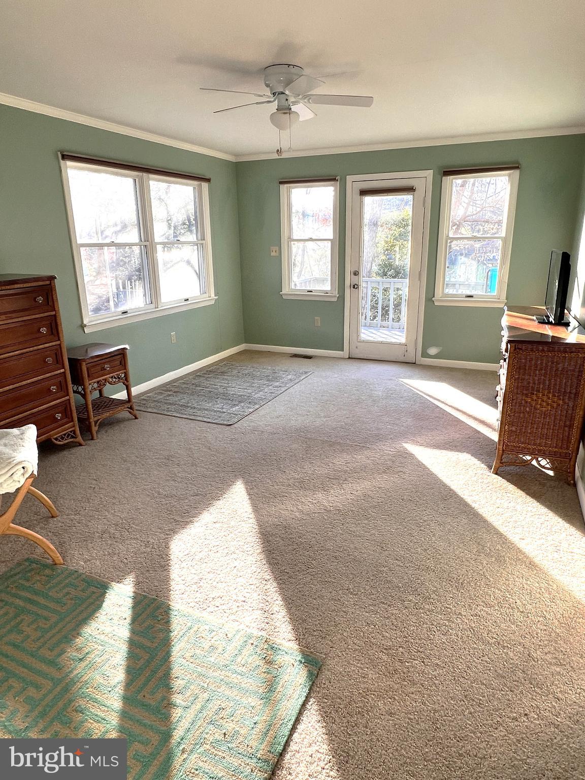 152 Swann Court Reedville, VA 22539 - Photo 18 of 33 a furnished livingroom with windows and bathroom