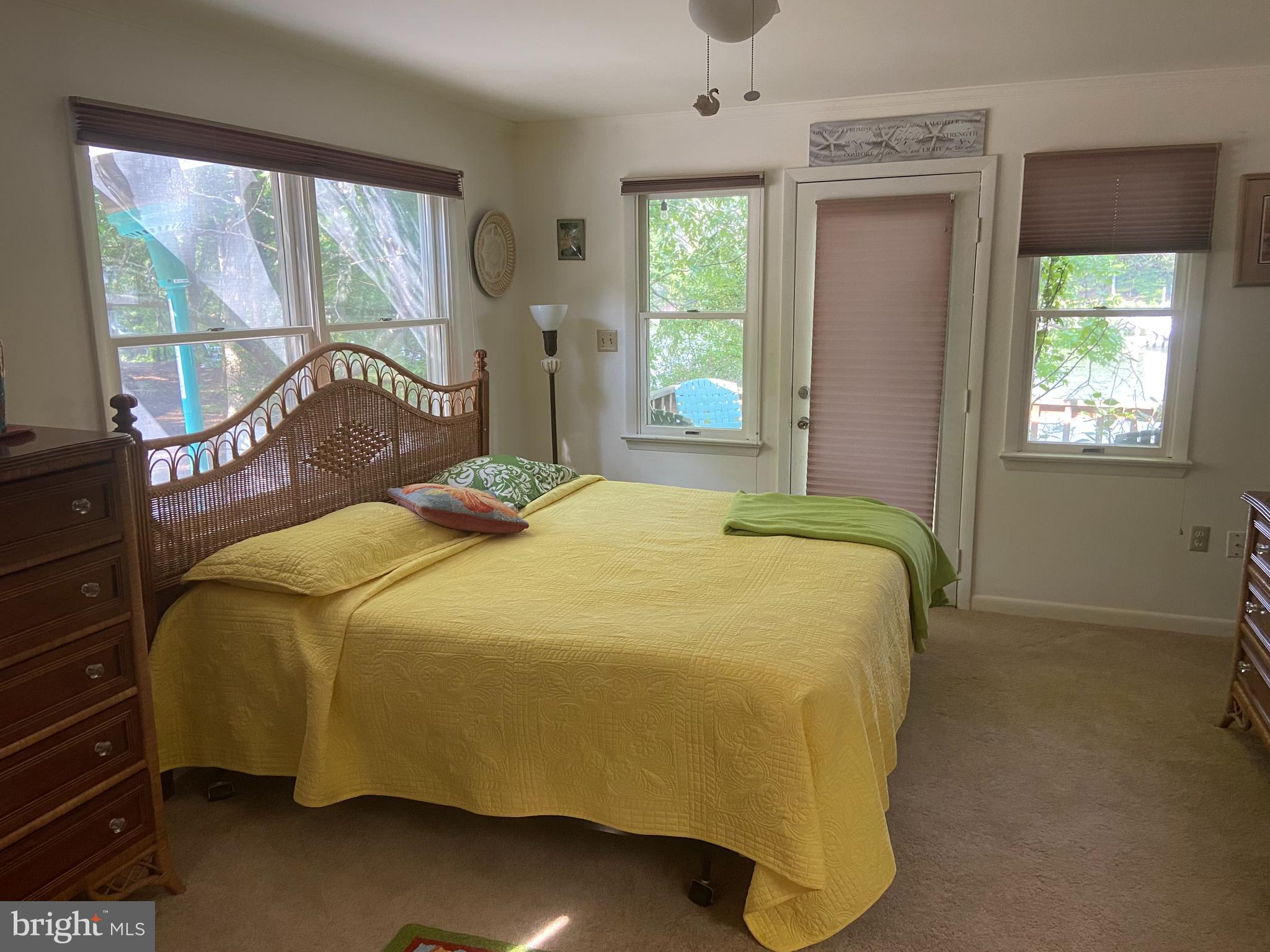 152 Swann Court Reedville, VA 22539 - Photo 19 of 33 a bedroom with a bed and window