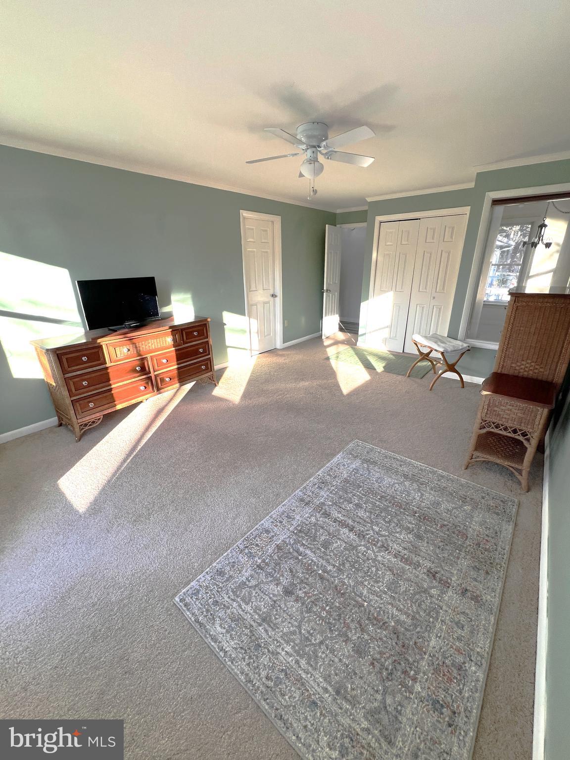 152 Swann Court Reedville, VA 22539 - Photo 20 of 33 a living room with furniture and a flat screen tv