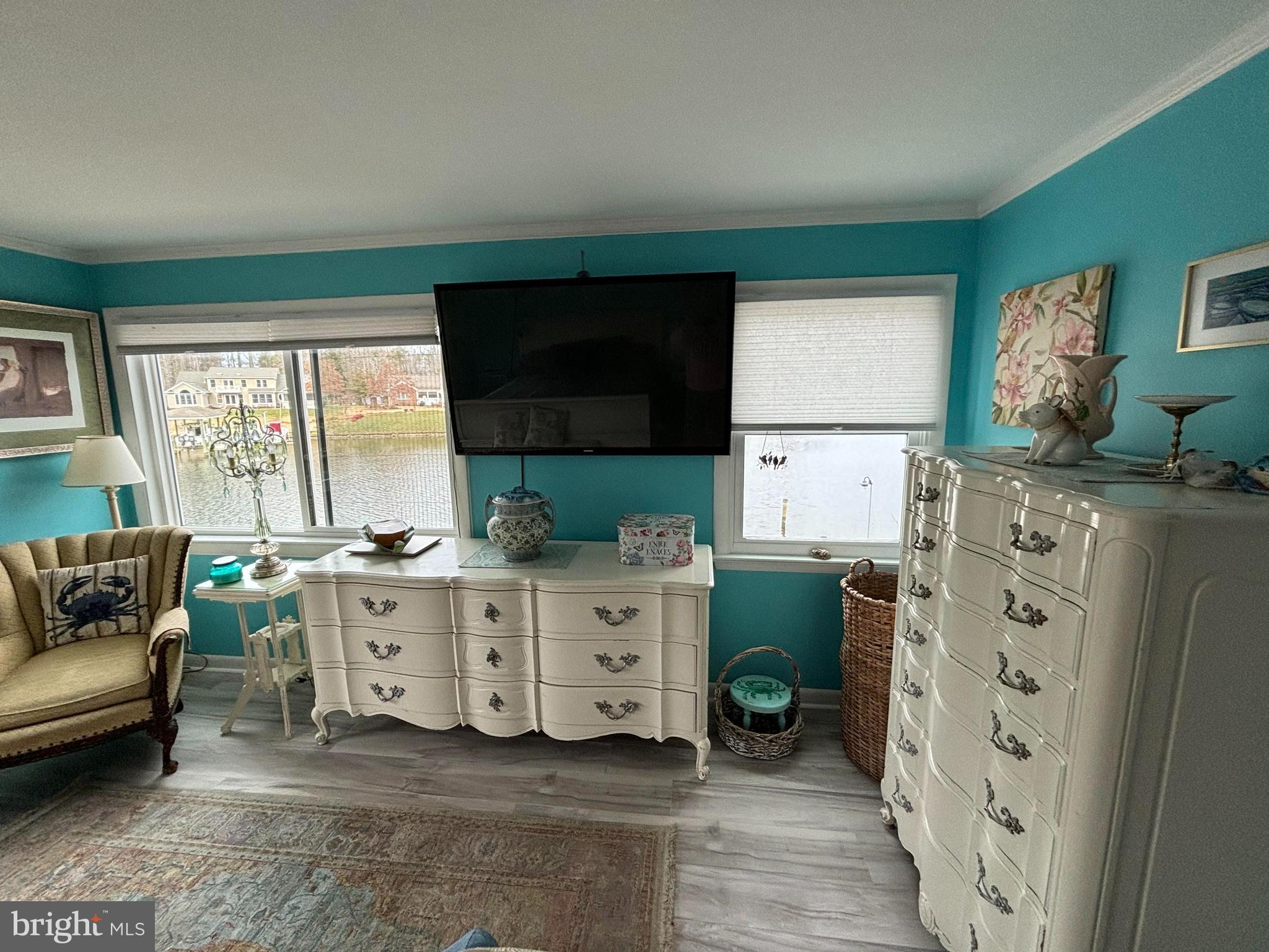 152 Swann Court Reedville, VA 22539 - Photo 22 of 33 a room with furniture a large window and flat screen tv