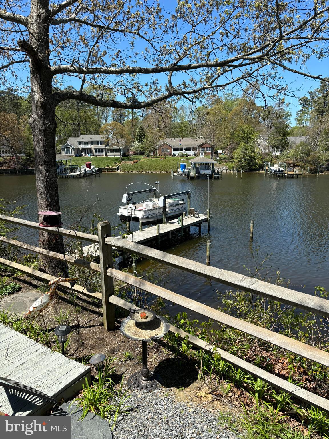 152 Swann Court Reedville, VA 22539 - Photo 26 of 33 a view of a lake from a balcony