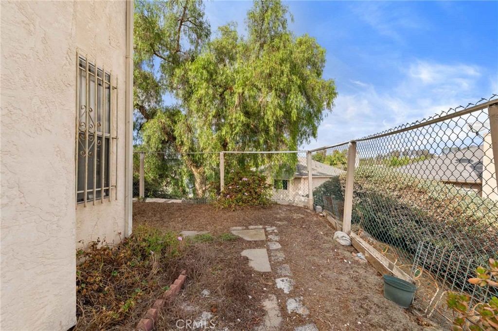 4142 Ocaso Way Oceanside, CA 92056 - Photo 13 of 16 a view of a pathway of a house with a street