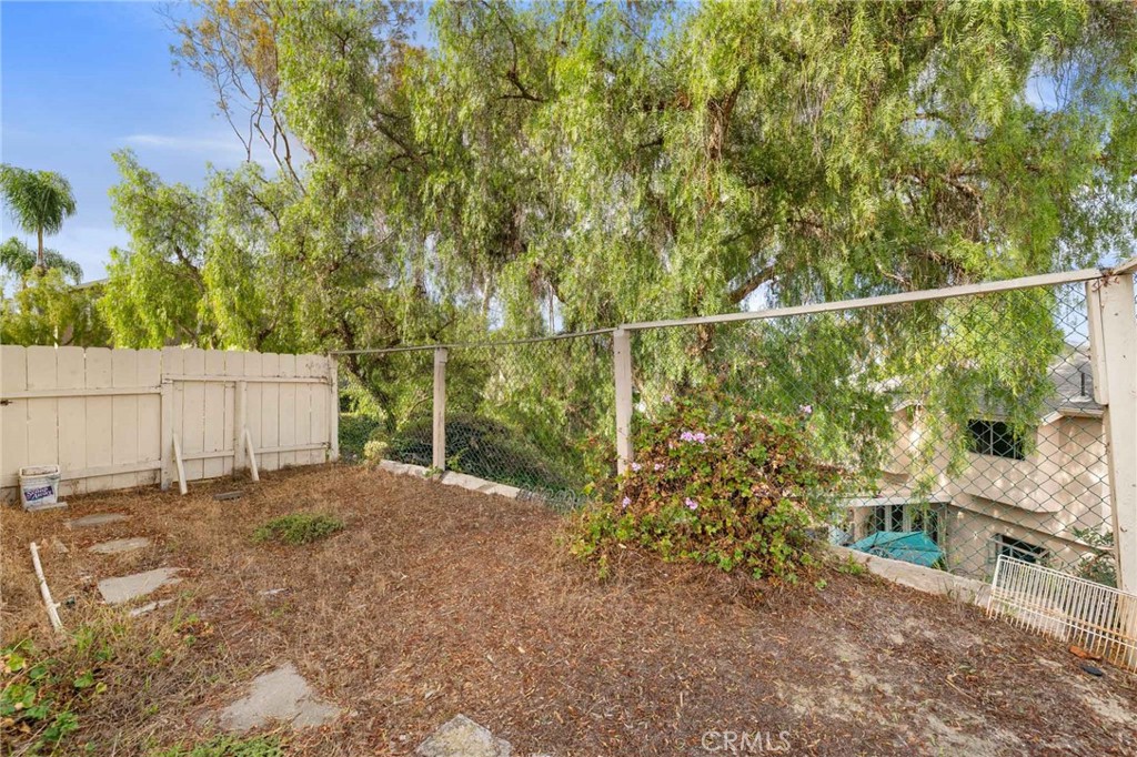 4142 Ocaso Way Oceanside, CA 92056 - Photo 14 of 16 a backyard of a house with lots of green space