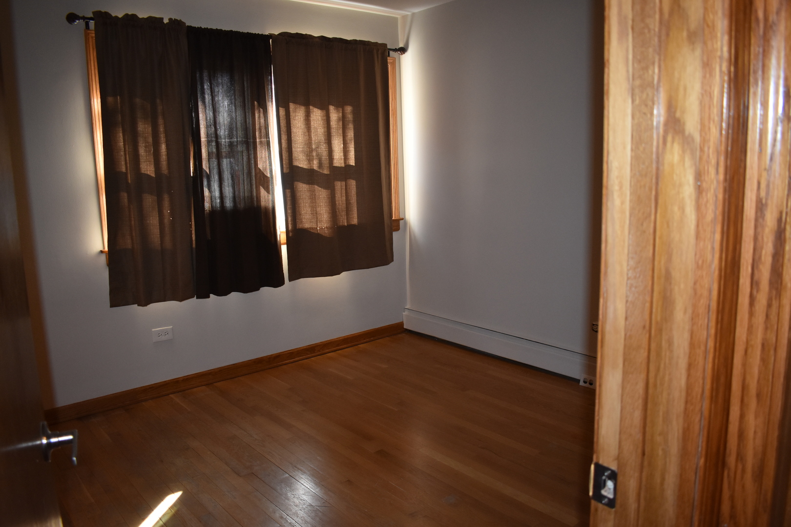 50 West Avenue, Unit 1S Riverside, IL 60546 - Photo 7 of 20 a view of an empty room with wooden floor