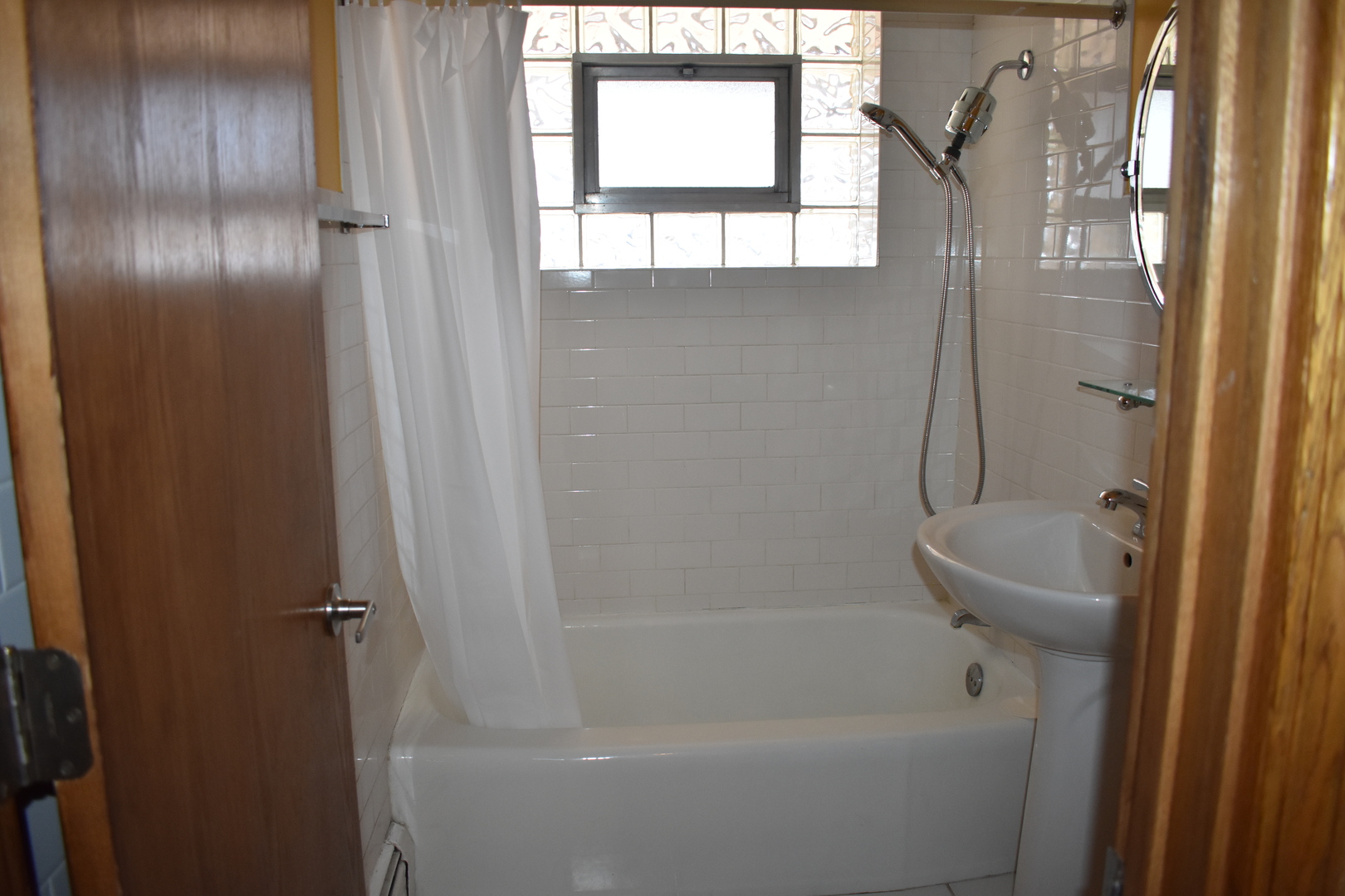 50 West Avenue, Unit 1S Riverside, IL 60546 - Photo 8 of 20 a bathroom with a bathtub and a shower