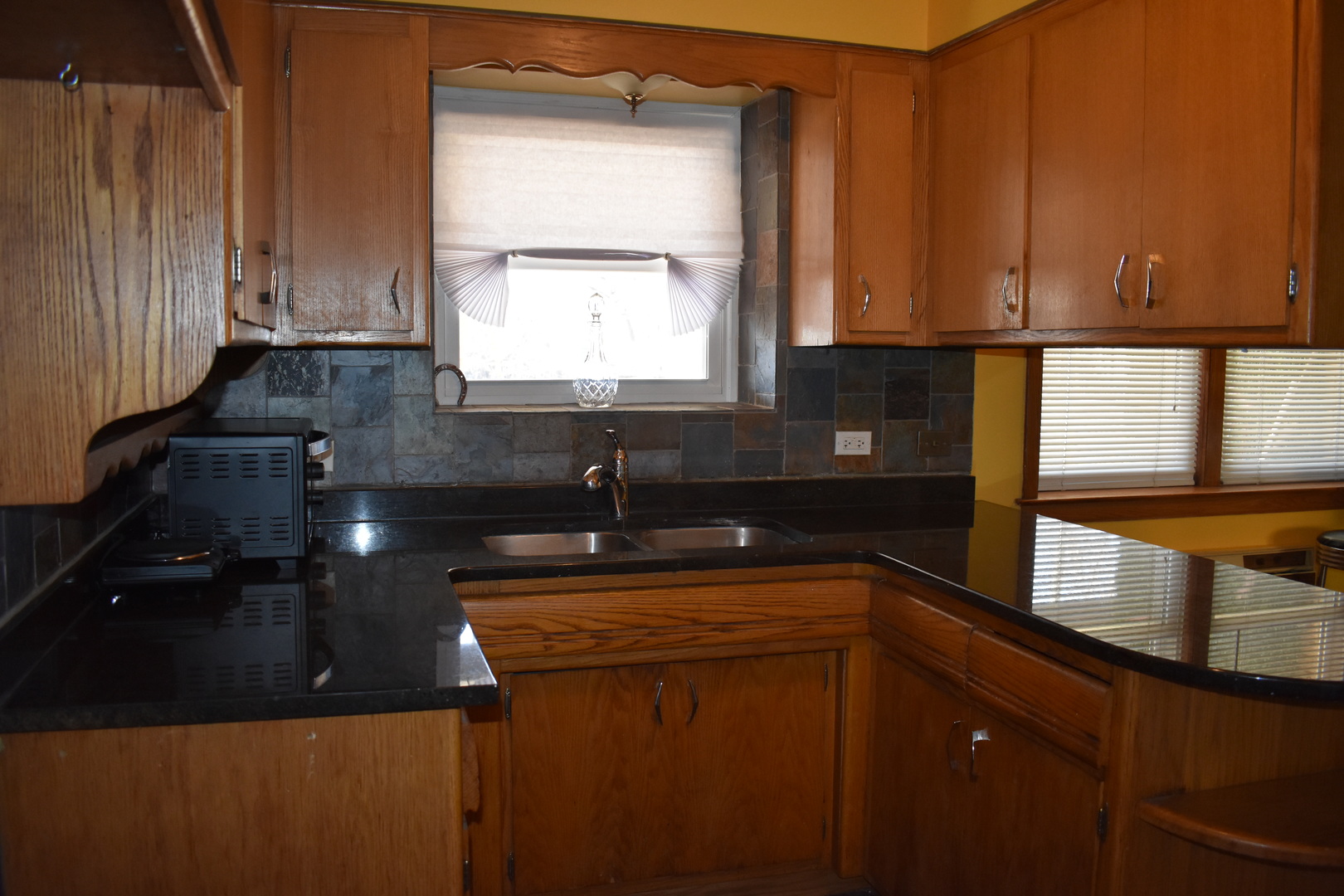 50 West Avenue, Unit 1S Riverside, IL 60546 - Photo 9 of 20 a kitchen with stainless steel appliances a sink stove and cabinets