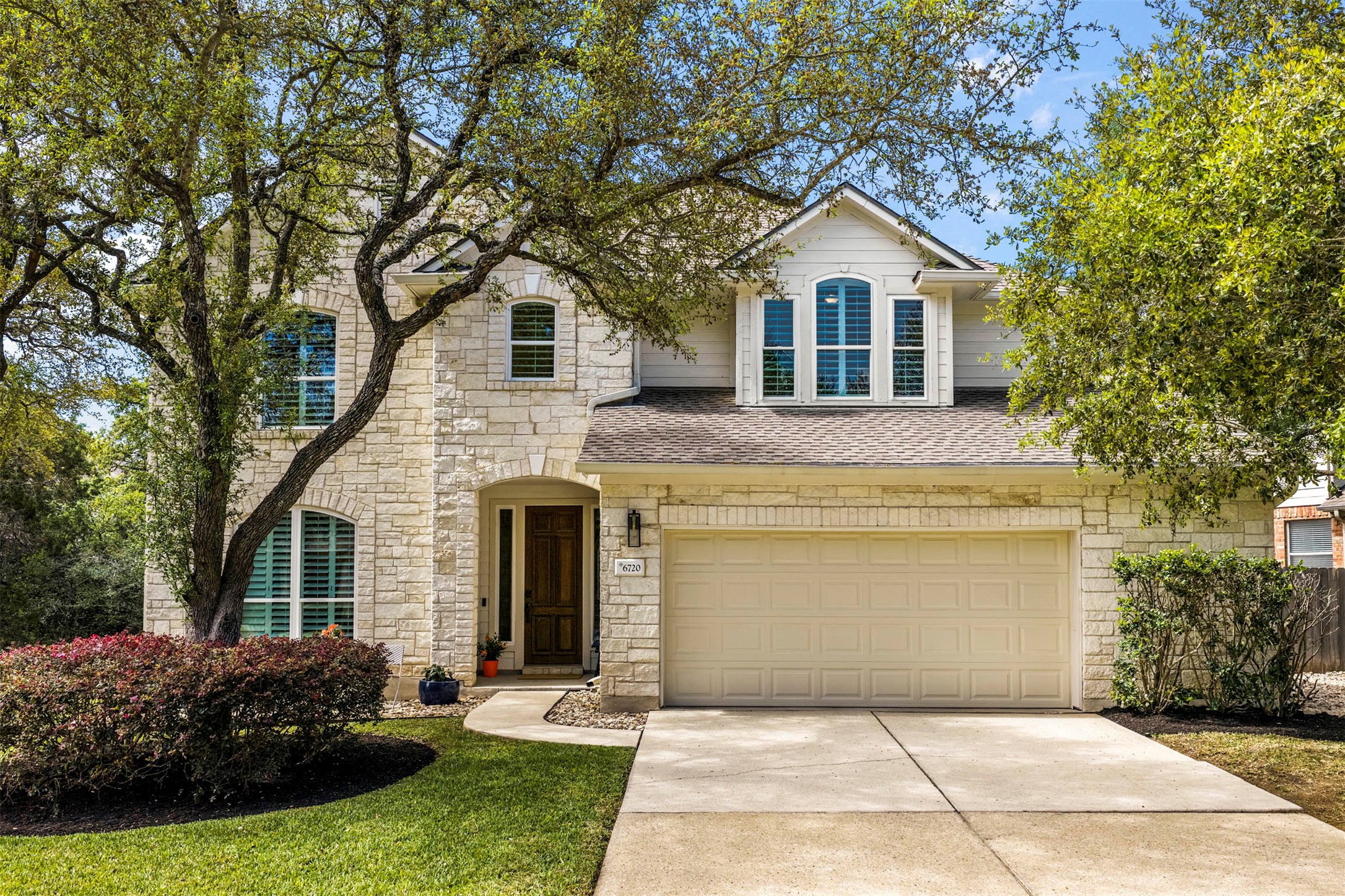 6720 Hansa Loop Austin, TX 78739 - Photo 1 of 1 Welcome to this quiet stretch of Hansa Loop in Circle C Ranch, where mature trees and professional landscaping frame a peaceful street presence