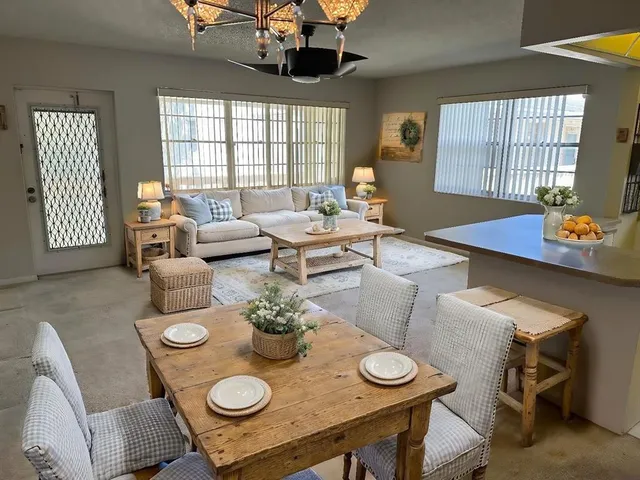 a view of a dining room with furniture and window