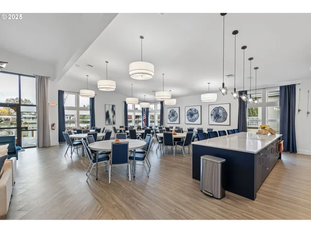 a large kitchen with a table and chairs
