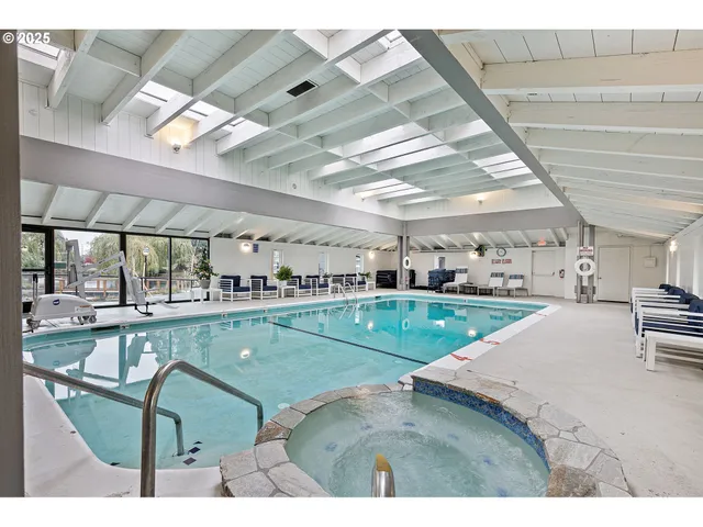 a view of swimming pool with outdoor seating