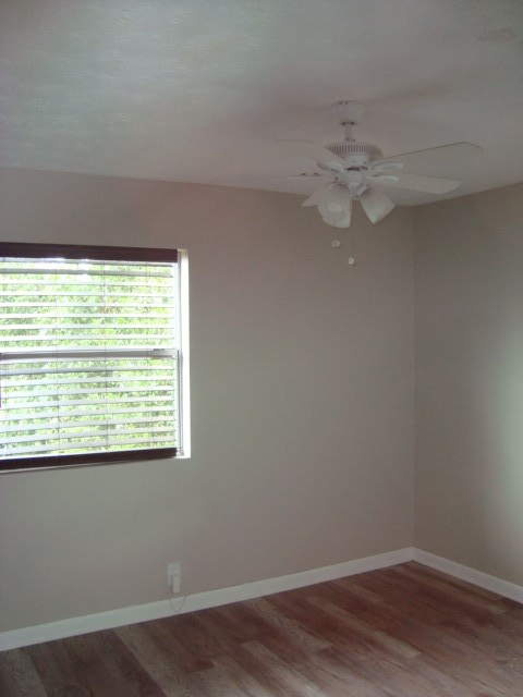 6228 Potomac Circle Columbus, GA 31909 - Photo 11 of 16 wooden floor in an empty room with a window