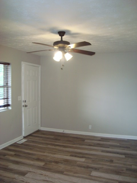 6228 Potomac Circle Columbus, GA 31909 - Photo 3 of 16 a view of a room with wooden floor fan and windows
