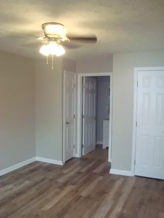 a view of a livingroom with a chandelier fan