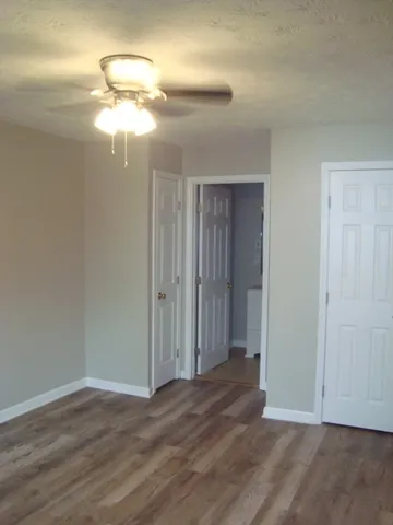 a view of a livingroom with a chandelier fan