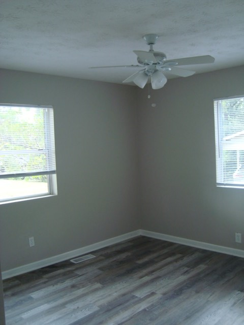 6228 Potomac Circle Columbus, GA 31909 - Photo 10 of 16 wooden floor in an empty room with a window