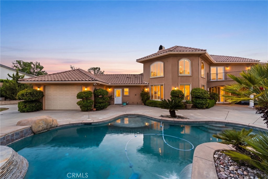 38136 Butterfly Court Yucaipa, CA 92399 - Photo 5 of 71 a front view of a house with garden