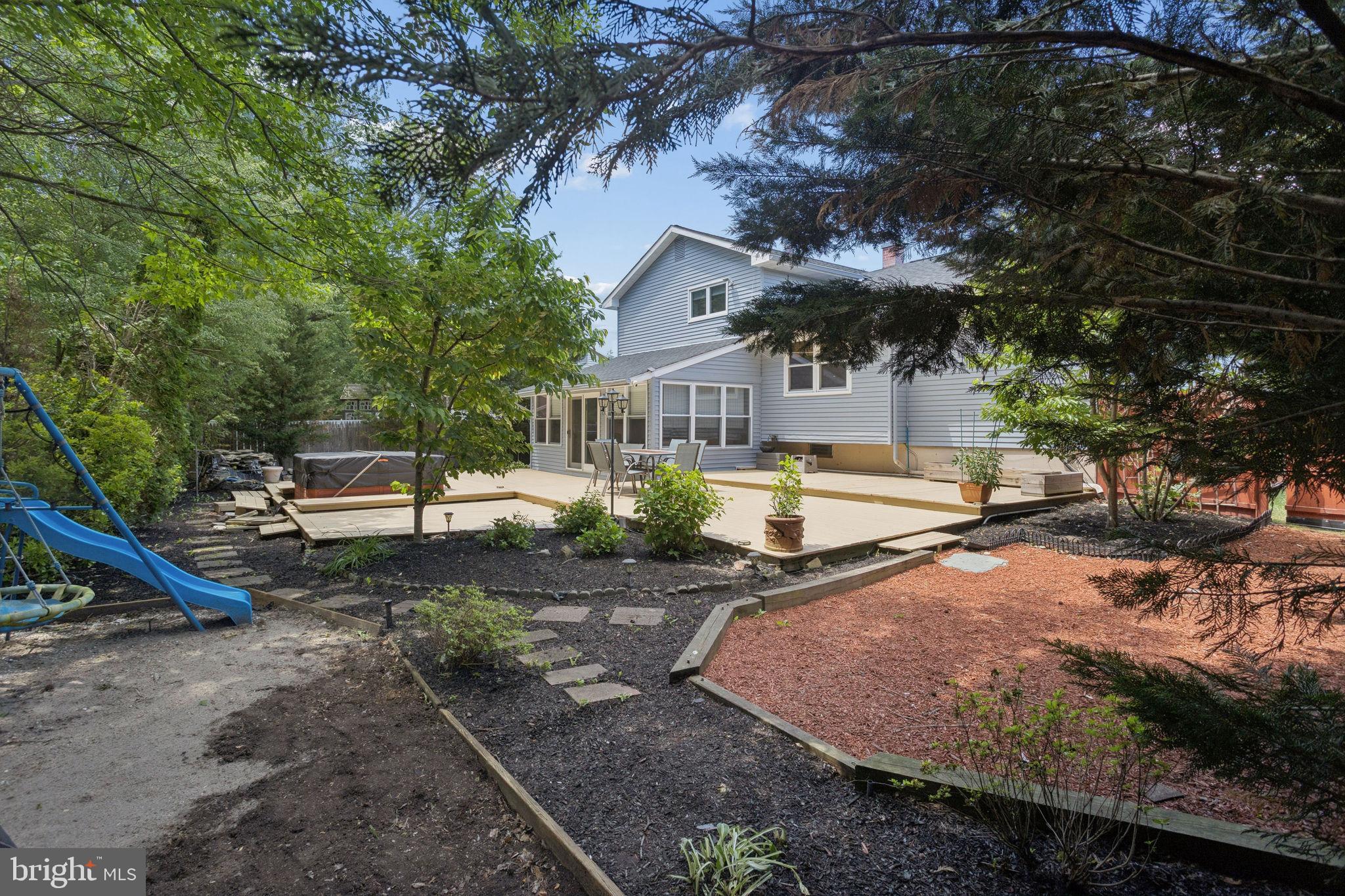 252 Sandringham Road Cherry Hill, NJ 08003 - Photo 30 of 31 a view of a house with a yard and sitting area