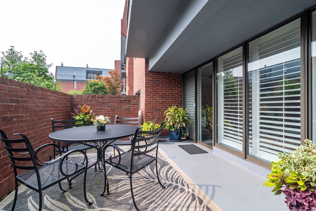 75 Grove Street, Unit 124 Wellesley, MA 02482 - Photo 18 of 22 a view of a outdoor seating area with furniture