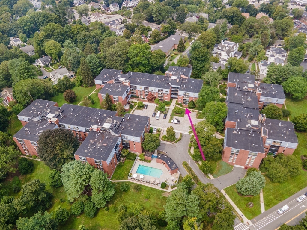 75 Grove Street, Unit 124 Wellesley, MA 02482 - Photo 20 of 22 an aerial view of house with yard swimming pool and outdoor seating