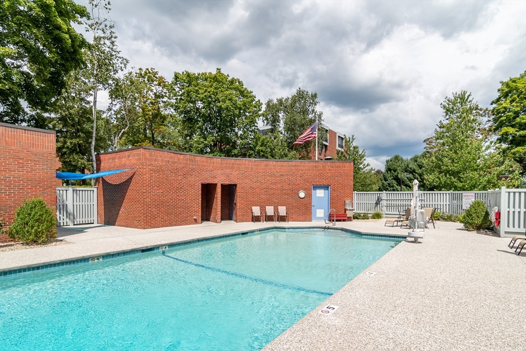 75 Grove Street, Unit 124 Wellesley, MA 02482 - Photo 22 of 22 a view of a house with a yard