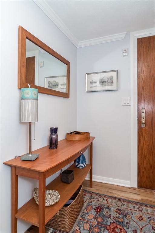 75 Grove Street, Unit 124 Wellesley, MA 02482 - Photo 3 of 22 a room with a table and a lamp