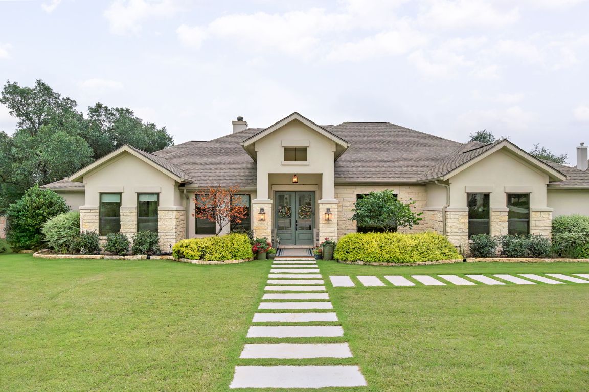a front view of a house with a yard