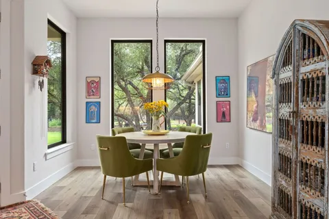 a view of a dining room with furniture window and outside view