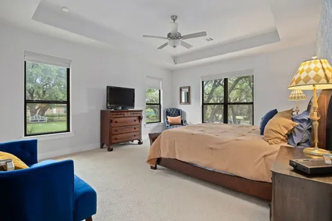 a spacious bathroom with a double vanity sink and a mirror