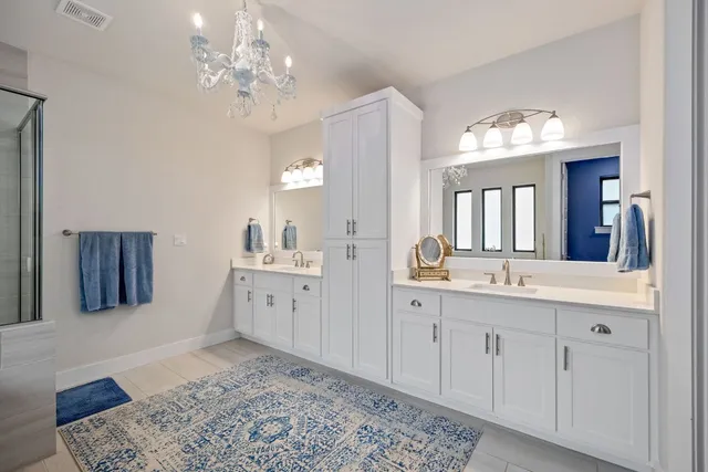 a spacious bathroom with a bathtub and a shower
