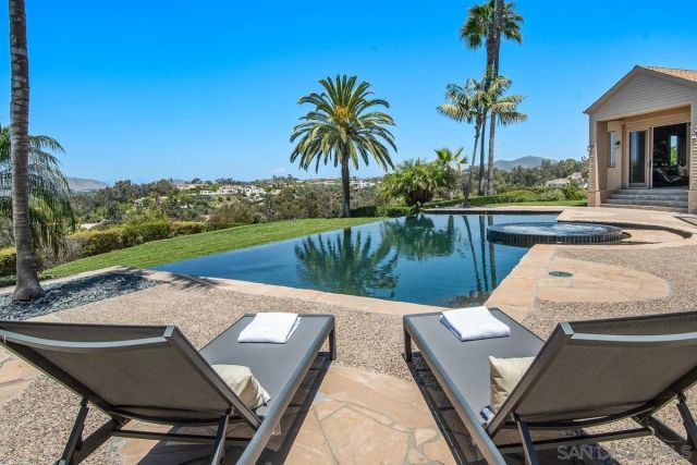 a view of a patio with swimming pool