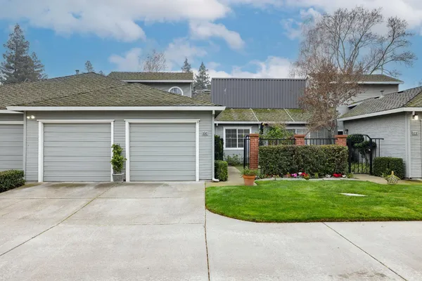 a view of a house with a backyard
