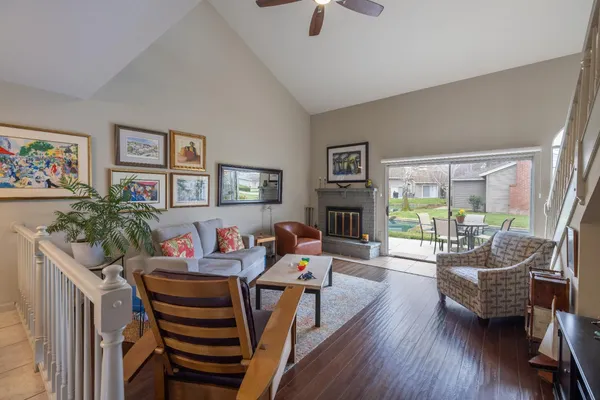 a living room with furniture and next to a window