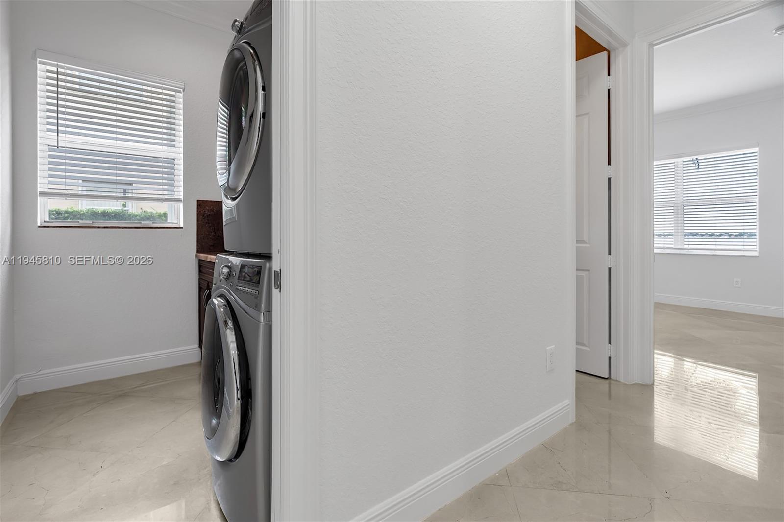 17809 Southwest 54th Street Miramar, FL 33029 - Photo 16 of 94 a view of a storage & utility room with a washer dryer