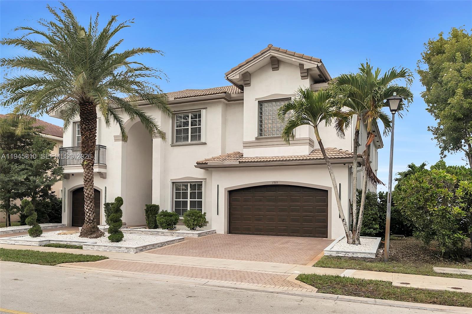 17809 Southwest 54th Street Miramar, FL 33029 - Photo 2 of 94 a front view of a house with yard and parking