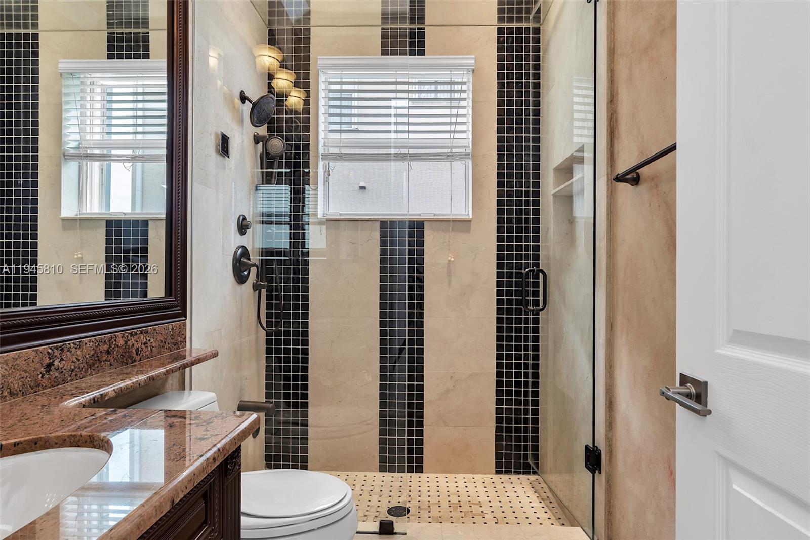 17809 Southwest 54th Street Miramar, FL 33029 - Photo 21 of 94 a bathroom with a sink toilet and shower