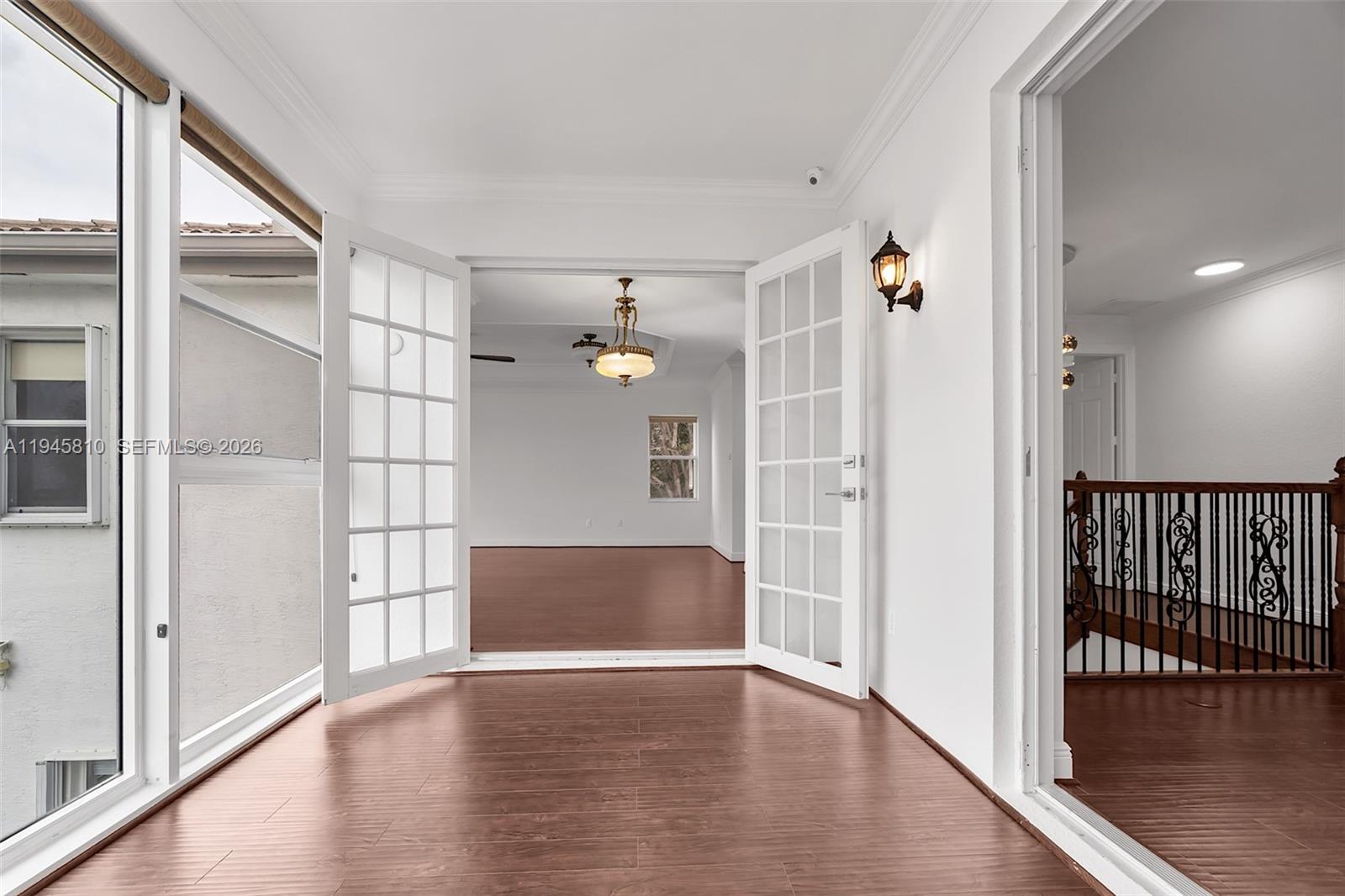 17809 Southwest 54th Street Miramar, FL 33029 - Photo 44 of 94 a view of empty room with wooden floor and fan